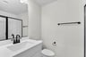 lower-level secondary bathroom with an oversized shower