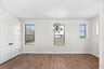 dining room with a pantry and several windows