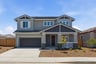 front exterior of two-story gray and white home with covered front porch
