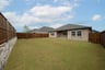 backyard with grass and covered patio