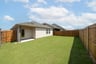 backyard with grass and covered patio