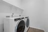 laundry room with included washer and dryer