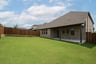 backyard with grass and covered patio