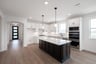 open kitchen with wood floors and island