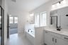 primary bathroom with soaking tub and walk-in shower