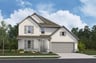 home with brick, windows, garage and landscaped grass 