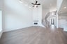 open great room with wood floors and fireplace