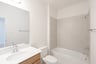 guest bathroom with tub