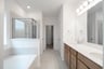 primary bathroom with soaking tub and shower