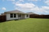 backyard with grass and covered patio
