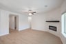 open great room with wood floors and fireplace