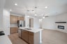 open kitchen with wood floors and island