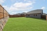 backyard with grass and covered patio