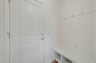 mudroom with a bench with cubbies and hooks