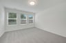 primary bedroom with three windows