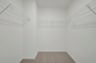 primary walk-in closet with wire shelving