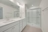 primary bathroom with an oversized shower