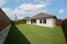 backyard with grass and covered patio
