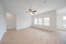 open great room with wood floors and ceiling fan