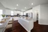 open kitchen with white cabinetry and hardwood flooring
