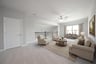 spacious loft with carpet and window