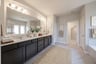 spacious primary bathroom with double sinks