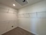 walk-in closet with carpet and wire shelving