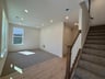 recreation room with access to the stairs