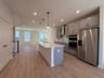 kitchen with a pantry and an island