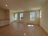 living room and office with four windows