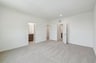 primary bedroom with carpet