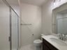 secondary bathroom with an oversized shower
