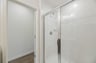 secondary bathroom with a walk-in shower