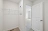 primary walk-in closet with wire shelving