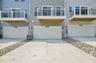 three-story townhome with a 2-car garage