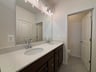 primary bathroom with dual vanities