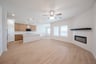 great room with wood flooring and fireplace 