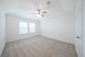 bedroom with windows with blinds 