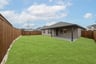 backyard with grass and covered patio