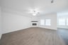 great room with fireplace and hard wood flooring