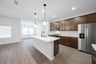 kitchen with open concept and brown cabinets