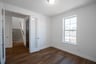 private study with wood floors and french doors