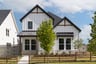 home exterior with stone and landscaping 