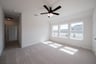 game room with carpet and ceiling fan 