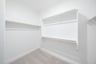 closet with hanging racks and shelves 