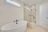 primary bath with separate tub and shower