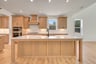 kitchen with an island with a sink