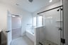 bathroom with walk-in shower and tub 