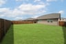 backyard with grass and covered patio