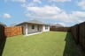 backyard with grass and covered patio